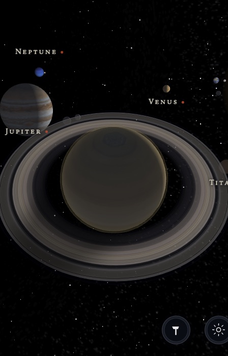 Saturn up close in the app — its rings tilted against the stars, with Jupiter, Venus, Titan and the Sun labelled around it.